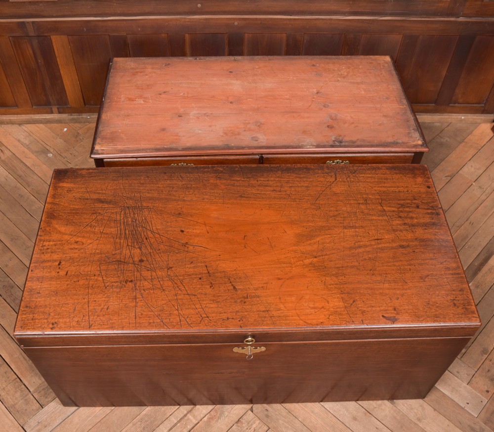 A Georgian mahogany mule chest featuring a hinged top lid above two lower drawers fitted with brass handles and keyhole escutcheons. View XIX