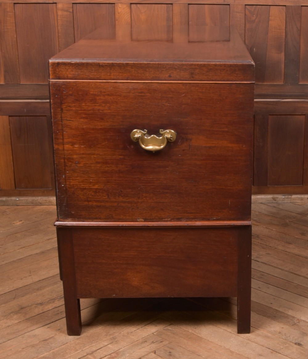 A Georgian mahogany mule chest featuring a hinged top lid above two lower drawers fitted with brass handles and keyhole escutcheons. View XX