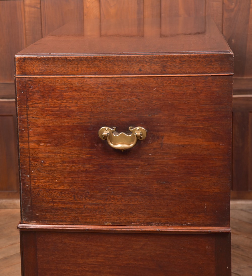 A Georgian mahogany mule chest featuring a hinged top lid above two lower drawers fitted with brass handles and keyhole escutcheons. View XXI