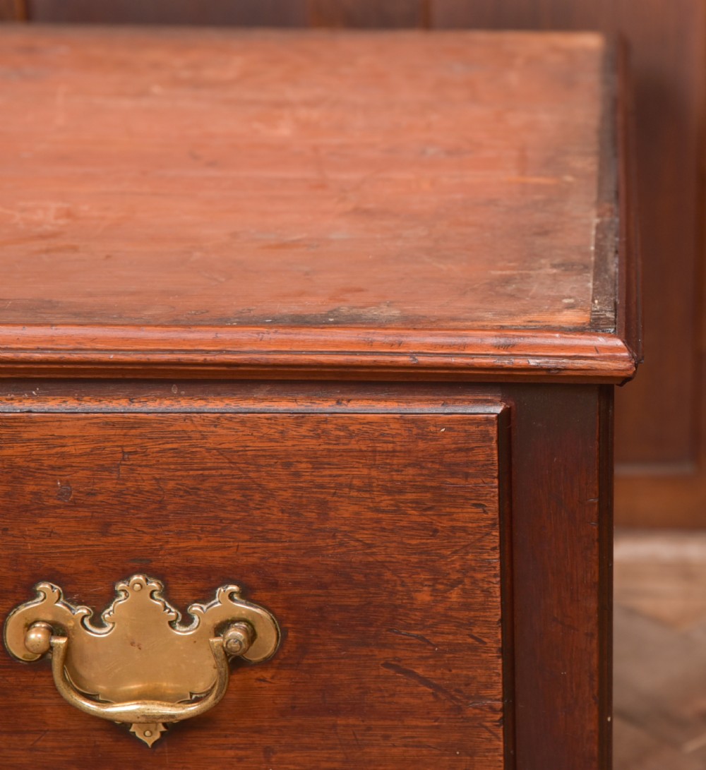 A Georgian mahogany mule chest featuring a hinged top lid above two lower drawers fitted with brass handles and keyhole escutcheons. View XXVII