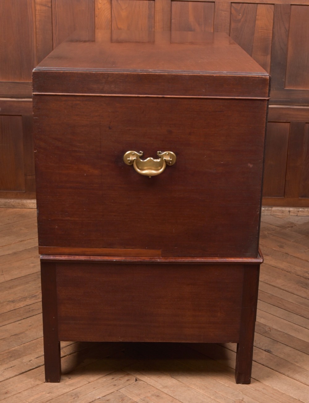 A Georgian mahogany mule chest featuring a hinged top lid above two lower drawers fitted with brass handles and keyhole escutcheons. View XXIX