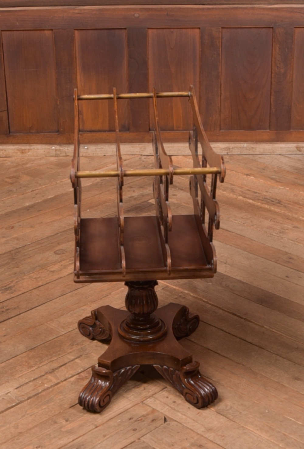 Victorian mahogany sheet music rack featuring pierced fretwork sides, divided compartments, a turned pedestal column, and carved scroll feet. View VIII