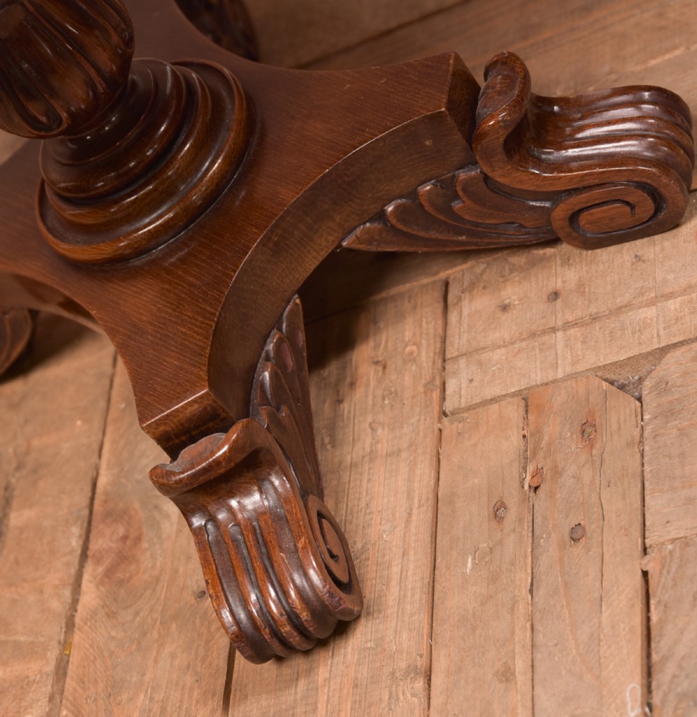 Victorian mahogany sheet music rack featuring pierced fretwork sides, divided compartments, a turned pedestal column, and carved scroll feet. View XI