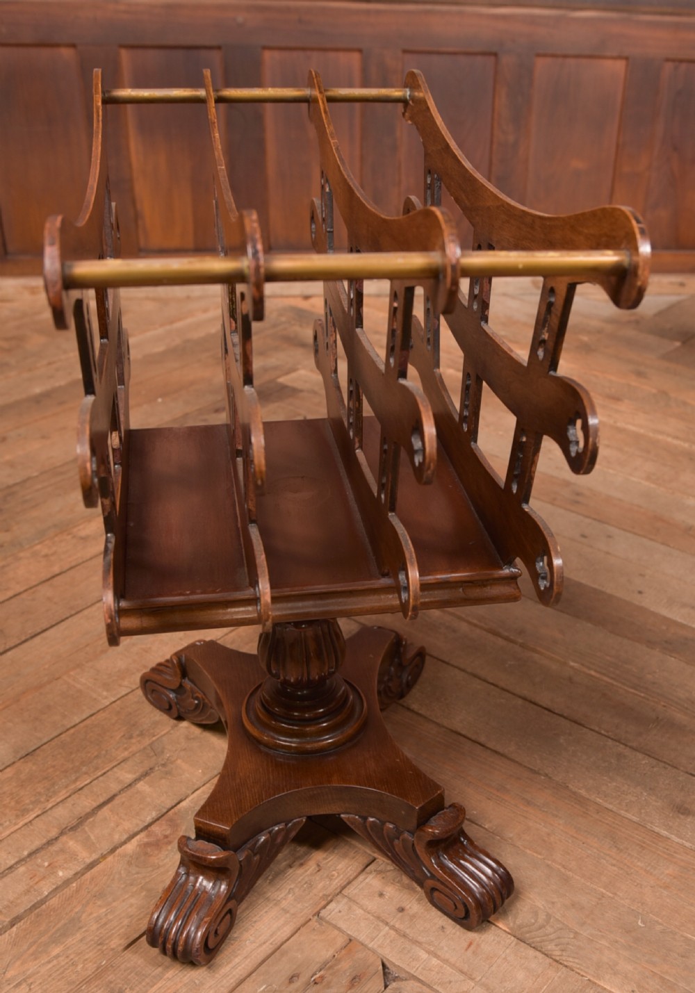 Victorian mahogany sheet music rack featuring pierced fretwork sides, divided compartments, a turned pedestal column, and carved scroll feet. View XII