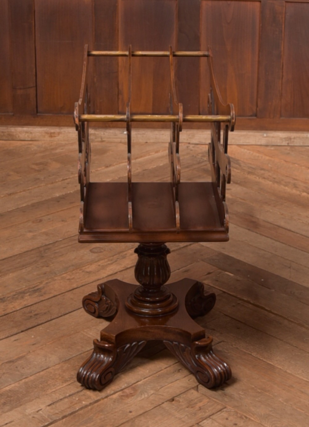 Victorian mahogany sheet music rack featuring pierced fretwork sides, divided compartments, a turned pedestal column, and carved scroll feet. View XV