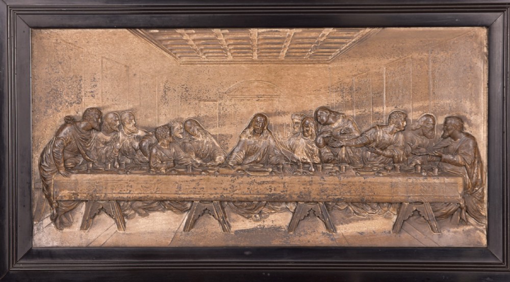 A 19th-century cast metal high-relief plaque depicting The Last Supper mounted inside a deep, black ebonised wooden frame. View II