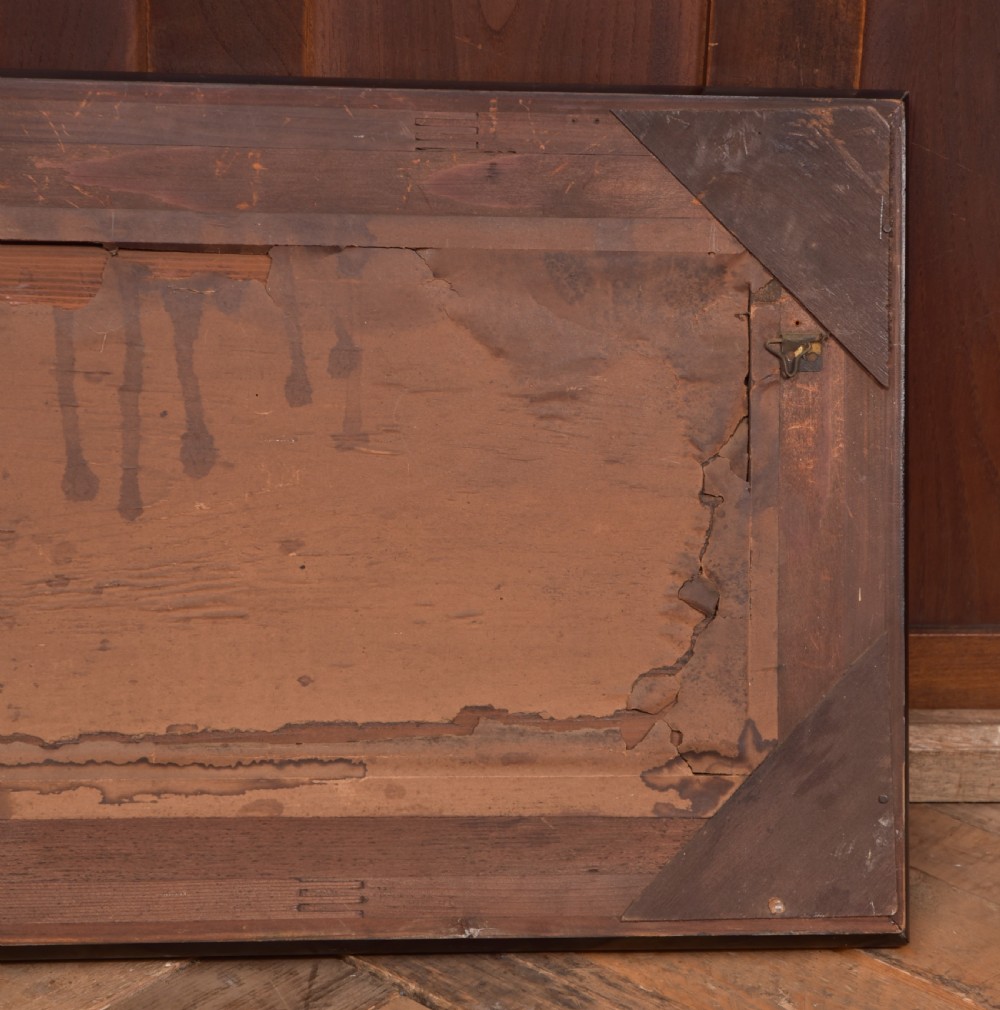 A 19th-century cast metal high-relief plaque depicting The Last Supper mounted inside a deep, black ebonised wooden frame. View IX