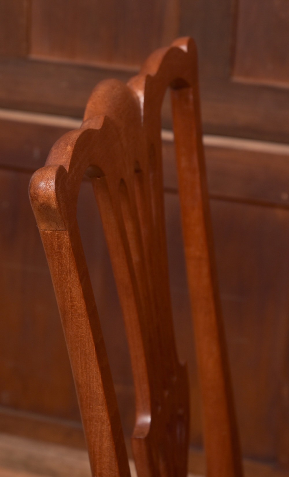 A matching pair of warm brown walnut side chairs with pierced vasiform splats, shaped crest rails, and upholstered drop-in seats supported by square legs with H-stretchers. View III