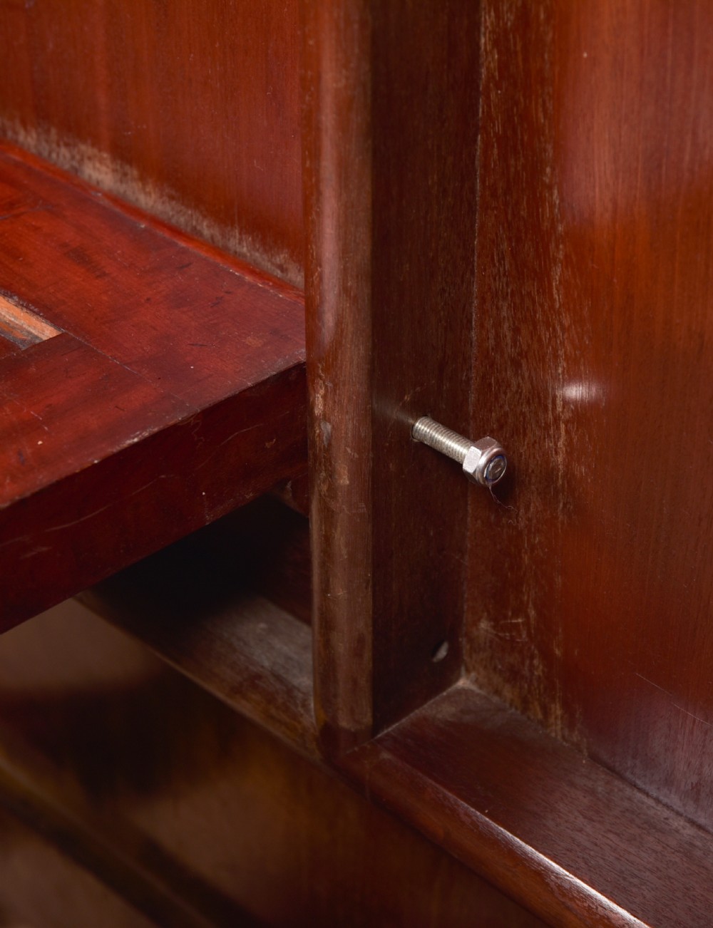 A Victorian mahogany tilt-top table featuring a polished rectangular top with rounded corners set upon a carved pedestal stem with quadruped scrolled legs. View XI