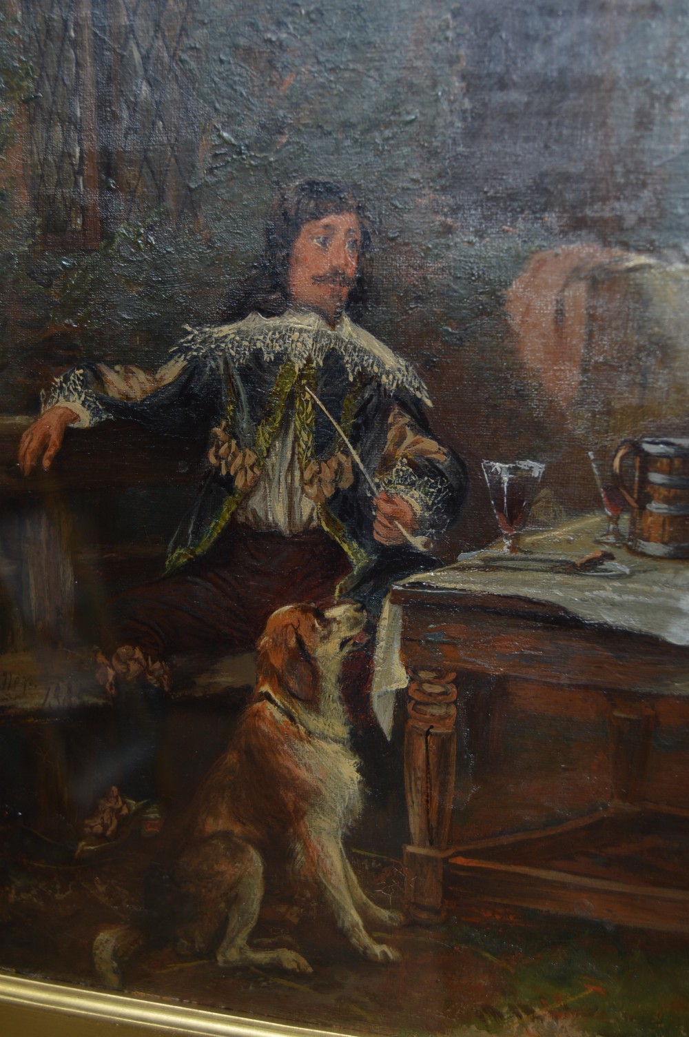 An antique oil painting depicting 17th-century cavaliers resting outside an inn, presented in an ornate gold gilt frame with an artist plaque. View VII