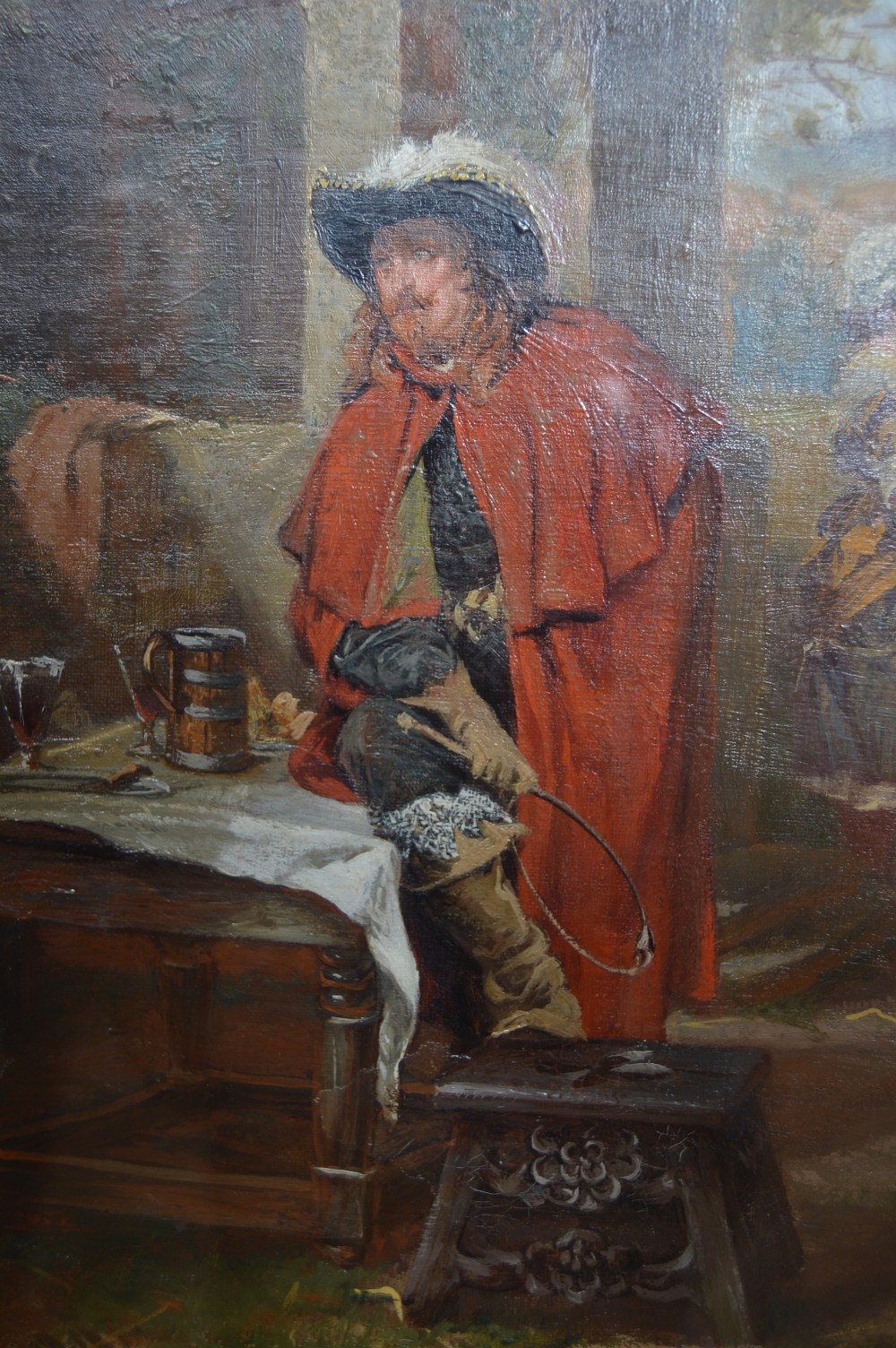 An antique oil painting depicting 17th-century cavaliers resting outside an inn, presented in an ornate gold gilt frame with an artist plaque. View XIII