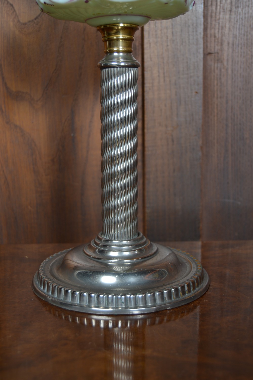 A Victorian Duplex oil lamp featuring an etched glass globe shade, hand-painted floral glass reservoir, spiralled silver-plated column, and stepped round base. View II