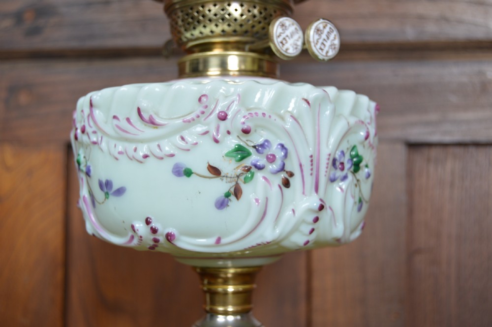 A Victorian Duplex oil lamp featuring an etched glass globe shade, hand-painted floral glass reservoir, spiralled silver-plated column, and stepped round base. View III