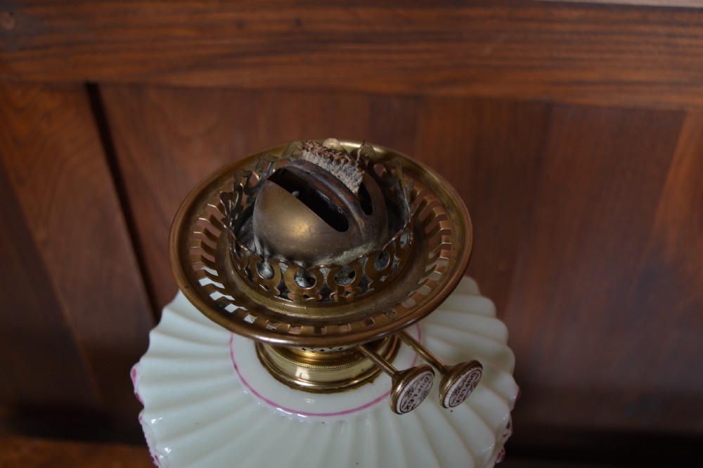 A Victorian Duplex oil lamp featuring an etched glass globe shade, hand-painted floral glass reservoir, spiralled silver-plated column, and stepped round base. View XI