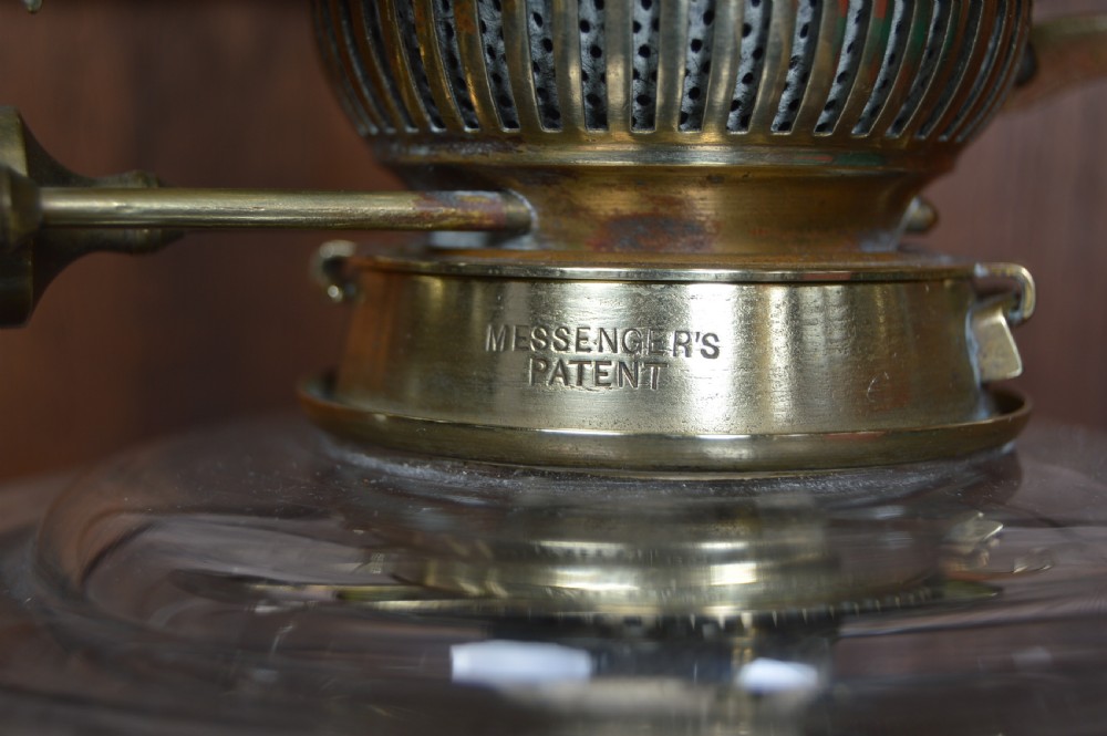 A Victorian brass oil lamp featuring a fluted column base, a clear glass reservoir, a light green swirl opalescent shade, and a tall glass chimney. View VII