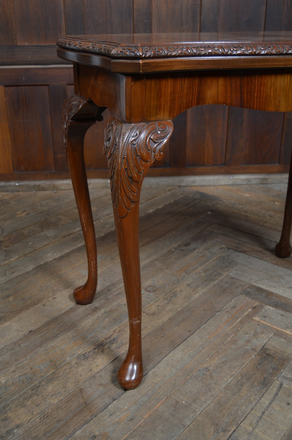 An antique walnut fold-over games table featuring carved cabriole legs, pad feet, and a figure-grained burr walnut top. View III