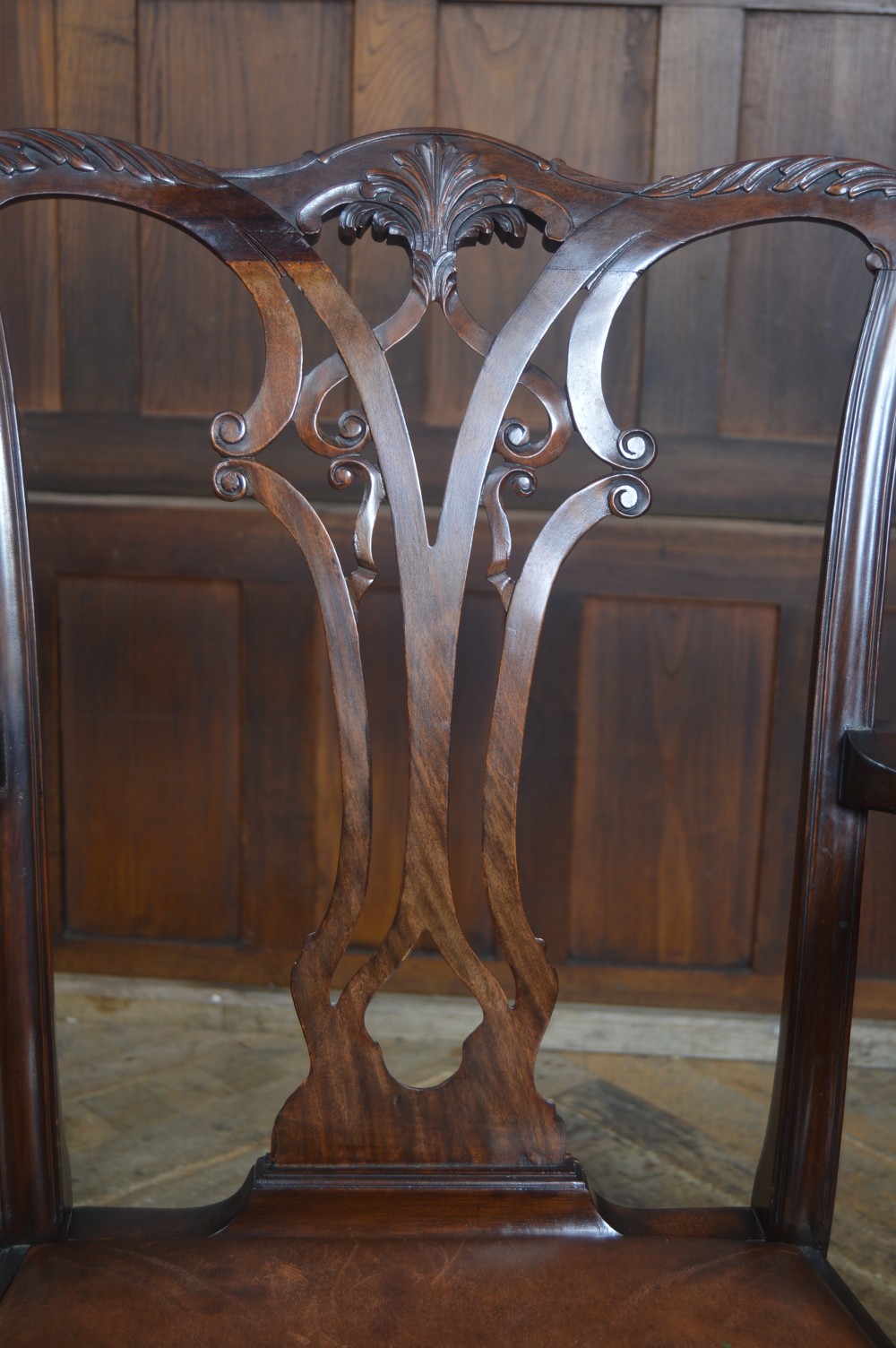 A set of eight dark mahogany Edwardian Chippendale style dining chairs featuring pierced back splats, leather seats, and cabriole legs with ball and claw feet. View XII