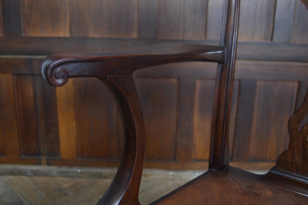 A set of eight dark mahogany Edwardian Chippendale style dining chairs featuring pierced back splats, leather seats, and cabriole legs with ball and claw feet. View XX