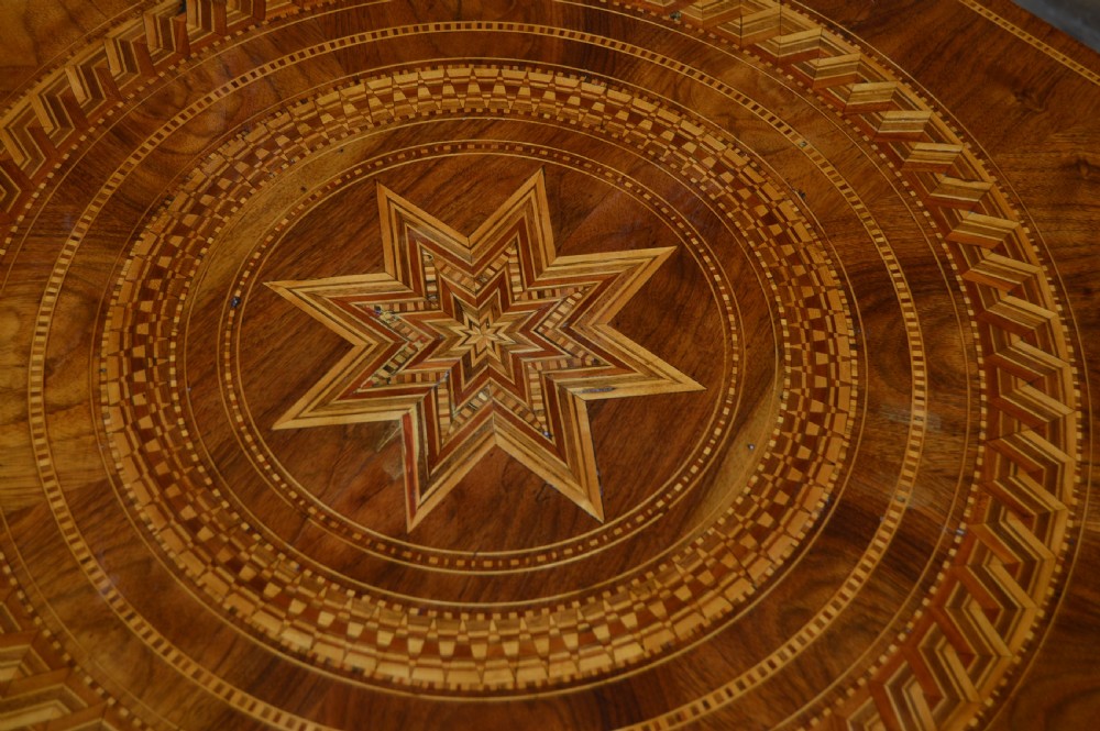 A Victorian octagonal Sorrento side table featuring intricate star marquetry, geometric inlays, a turned pedestal support, and a tripod base. View XI
