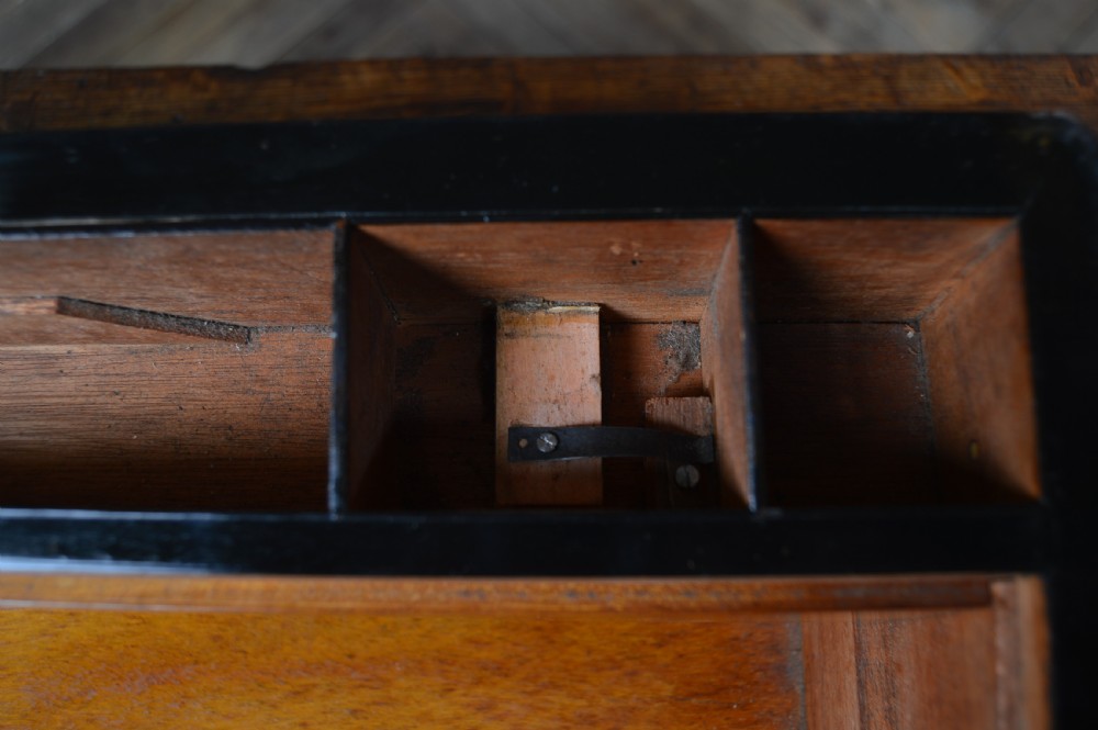 A closed rectangular Victorian burr walnut writing slope featuring metal border trim, a keyhole escutcheon, and an engraved metal presentation plaque on top. View XVI
