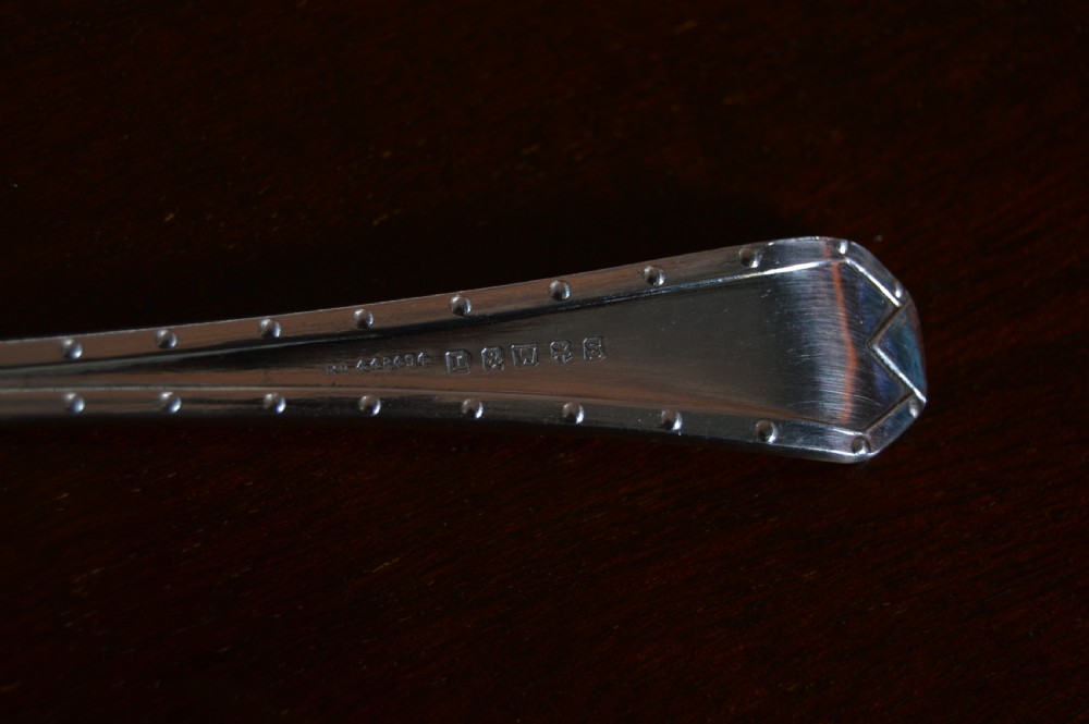 An open wooden canteen displaying a 12-person silver-plated fish cutlery set fitted against a deep blue velvet lining. View XIII