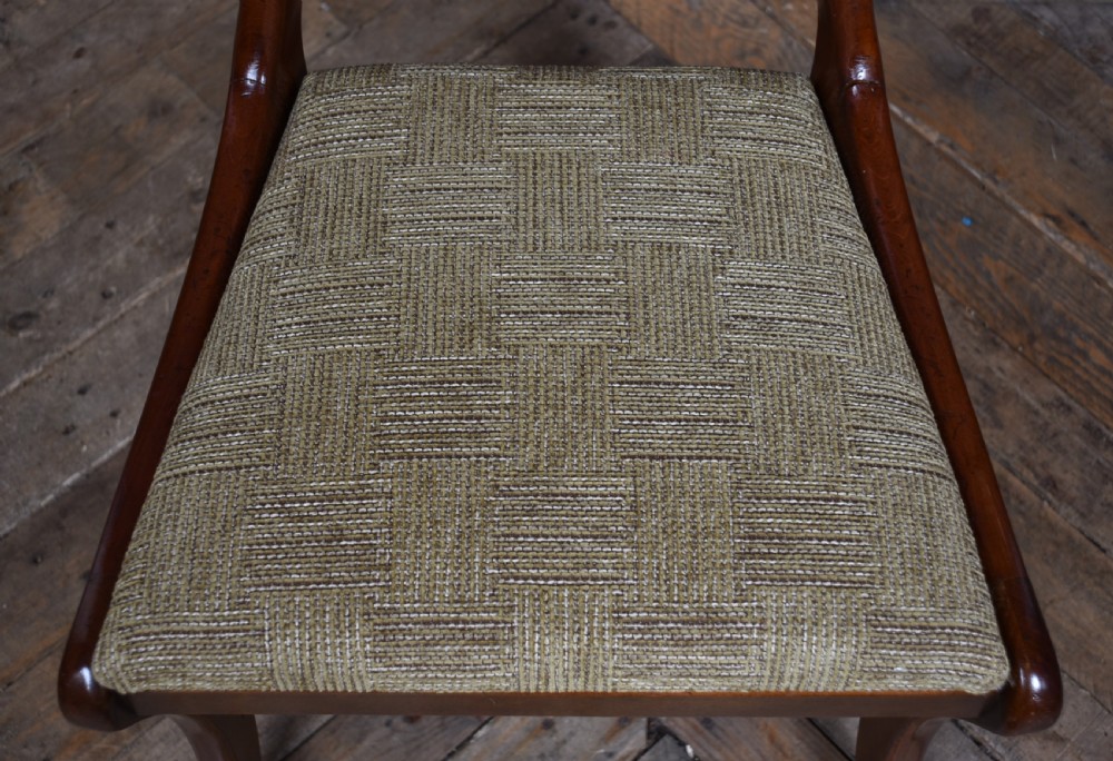A set of six Victorian walnut balloon back dining chairs featuring hand-carved openwork back splats, cabriole legs, and textured beige upholstery. View XI