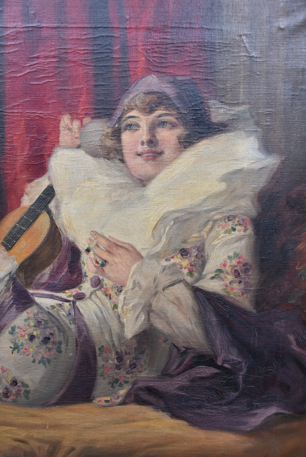A framed oil painting depicting figures in carnival attire, including a pierrot and a jester, set within an ornate gilded frame. View II
