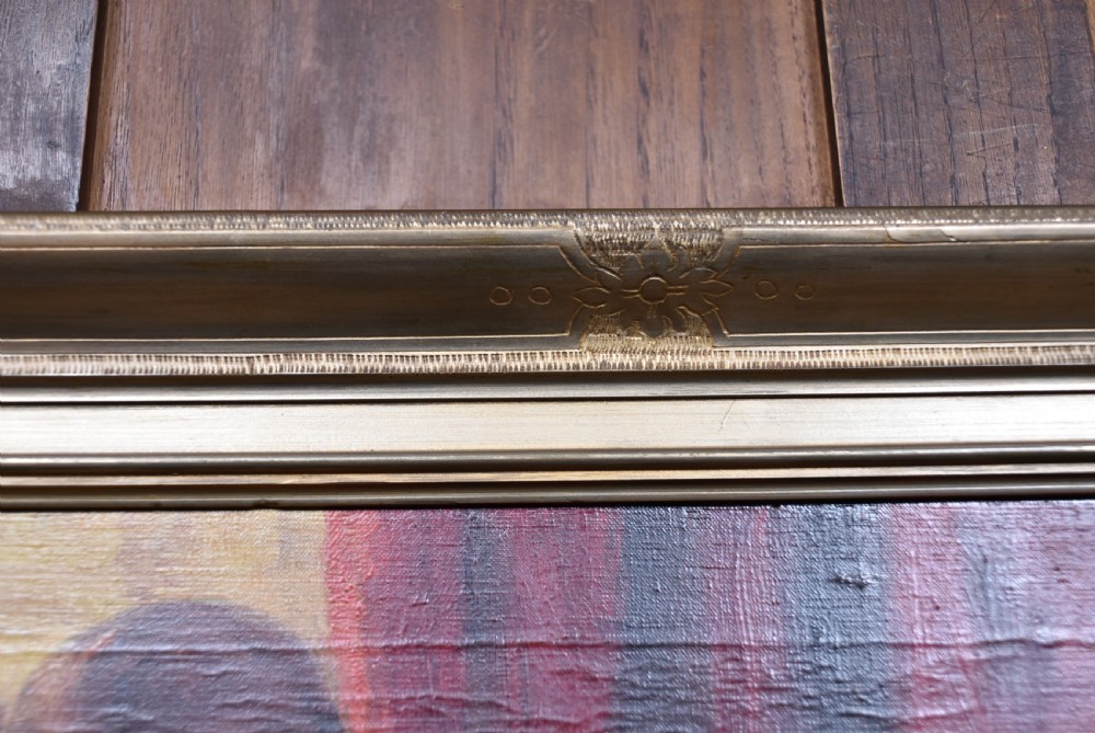A framed oil painting depicting figures in carnival attire, including a pierrot and a jester, set within an ornate gilded frame. View VI