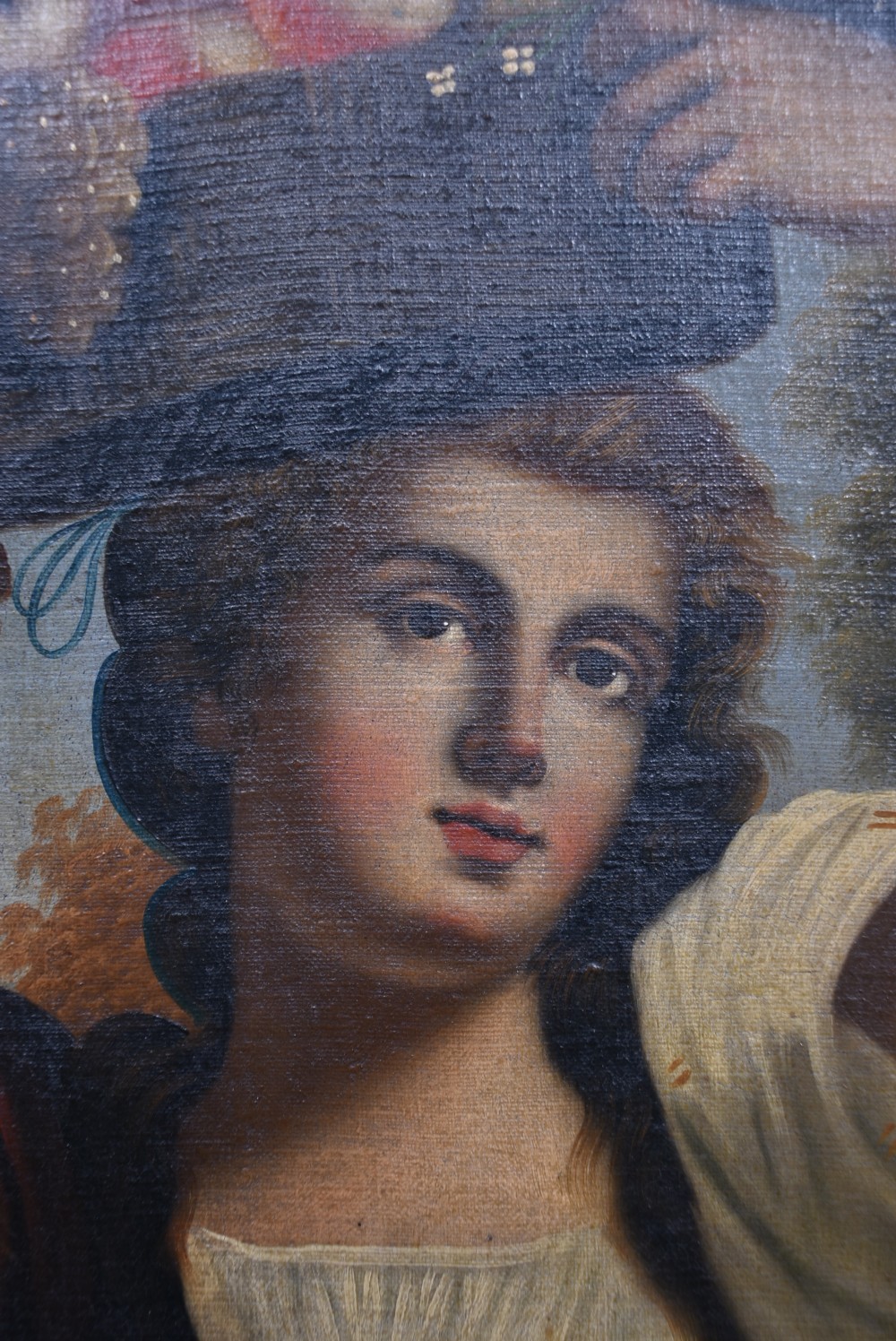 An oil painting on canvas depicting a classical woman holding a basket of fruit on her head, presented in a moulded gilded frame. View IV