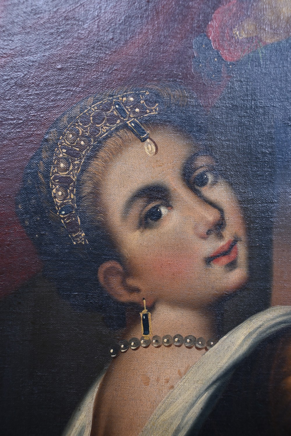 An oil painting on canvas featuring a female figure in classical dress holding a fruit bowl above her head, enclosed in an ornate gold-painted frame. View IV