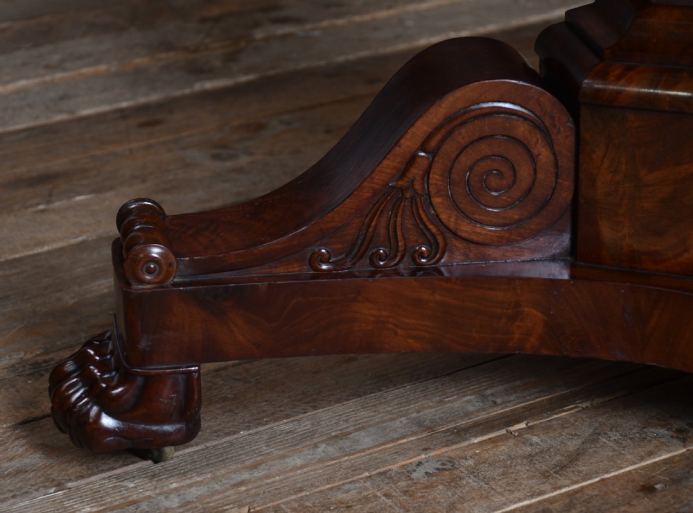 A 19th-century circular French gueridon centre table featuring a black marble top, dark mahogany apron, turned central pedestal, and scroll-carved tripod base with paw feet. View III