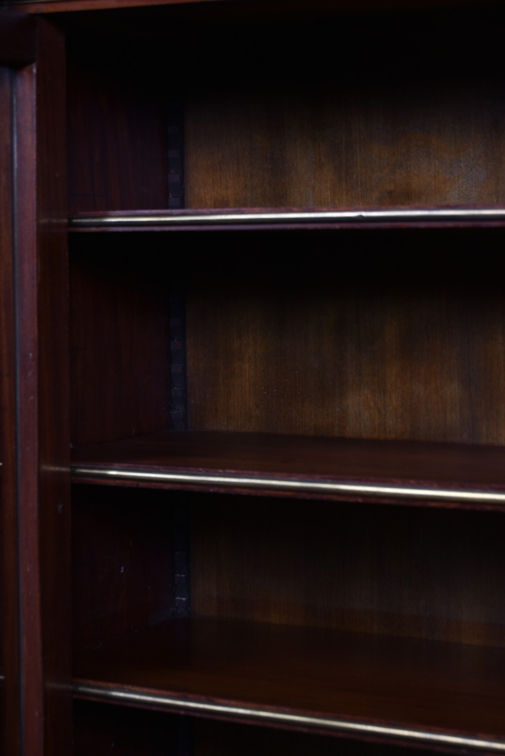 A French mahogany glazed bookcase featuring two glass-panelled doors, brass mounts, fluted side columns, and a light marble top. View XI
