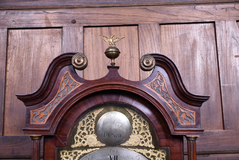 An antique Scottish mahogany longcase clock featuring a swan-neck pediment with an eagle finial and an engraved brass dial face. View V