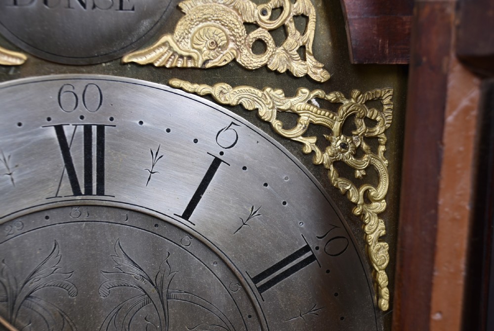 An antique Scottish mahogany longcase clock featuring a swan-neck pediment with an eagle finial and an engraved brass dial face. View XI