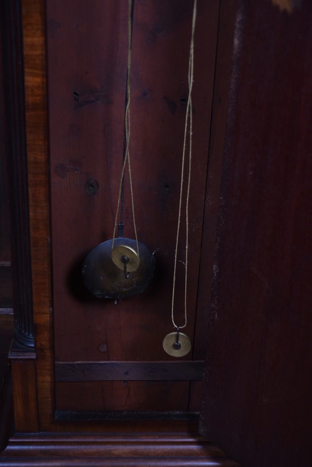 An antique Scottish mahogany longcase clock featuring a swan-neck pediment with an eagle finial and an engraved brass dial face. View XII
