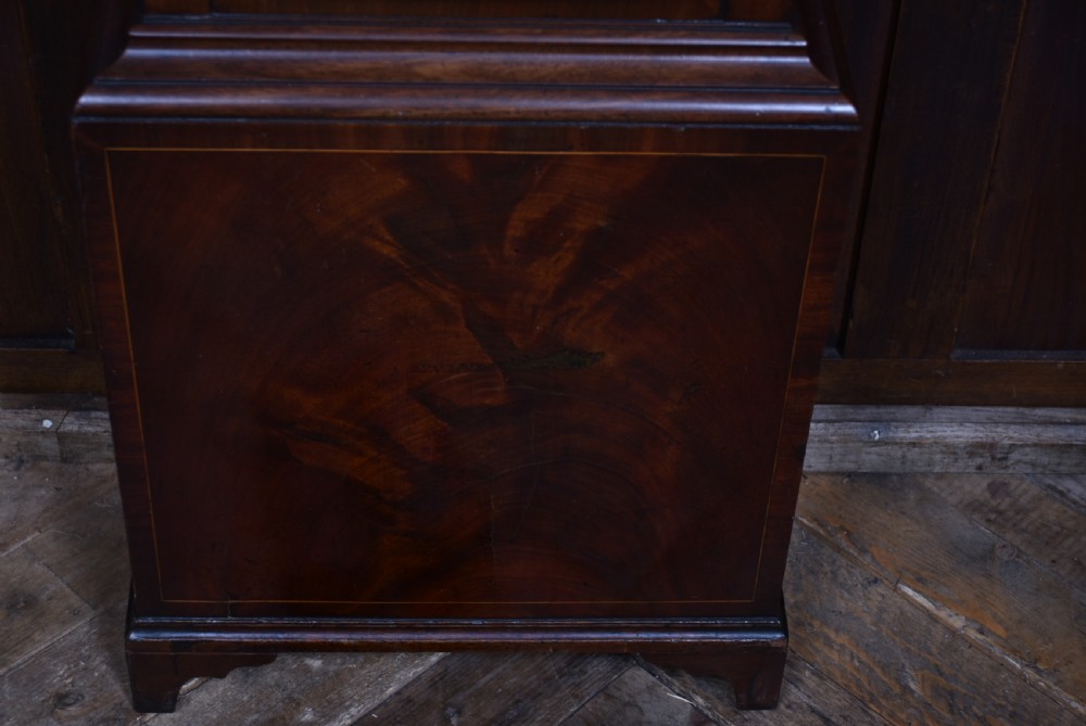 An antique Scottish mahogany longcase clock featuring a swan-neck pediment with an eagle finial and an engraved brass dial face. View XV