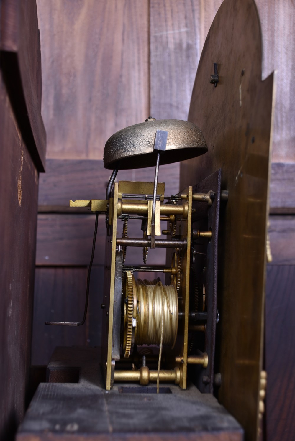An antique Scottish mahogany longcase clock featuring a swan-neck pediment with an eagle finial and an engraved brass dial face. View XIX