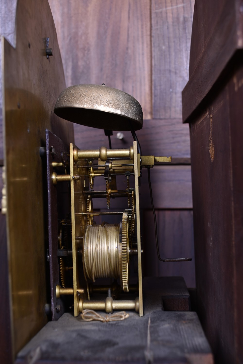 An antique Scottish mahogany longcase clock featuring a swan-neck pediment with an eagle finial and an engraved brass dial face. View XXI