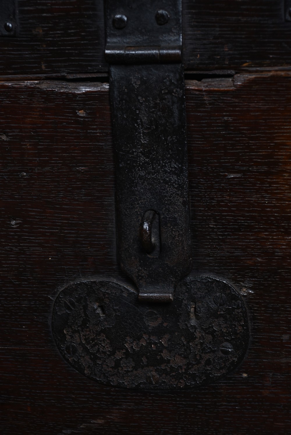A dark oak Victorian silver chest featuring heavy black iron straps, corner brackets, studded detailing, and an engraved brass plaque on the front. View V