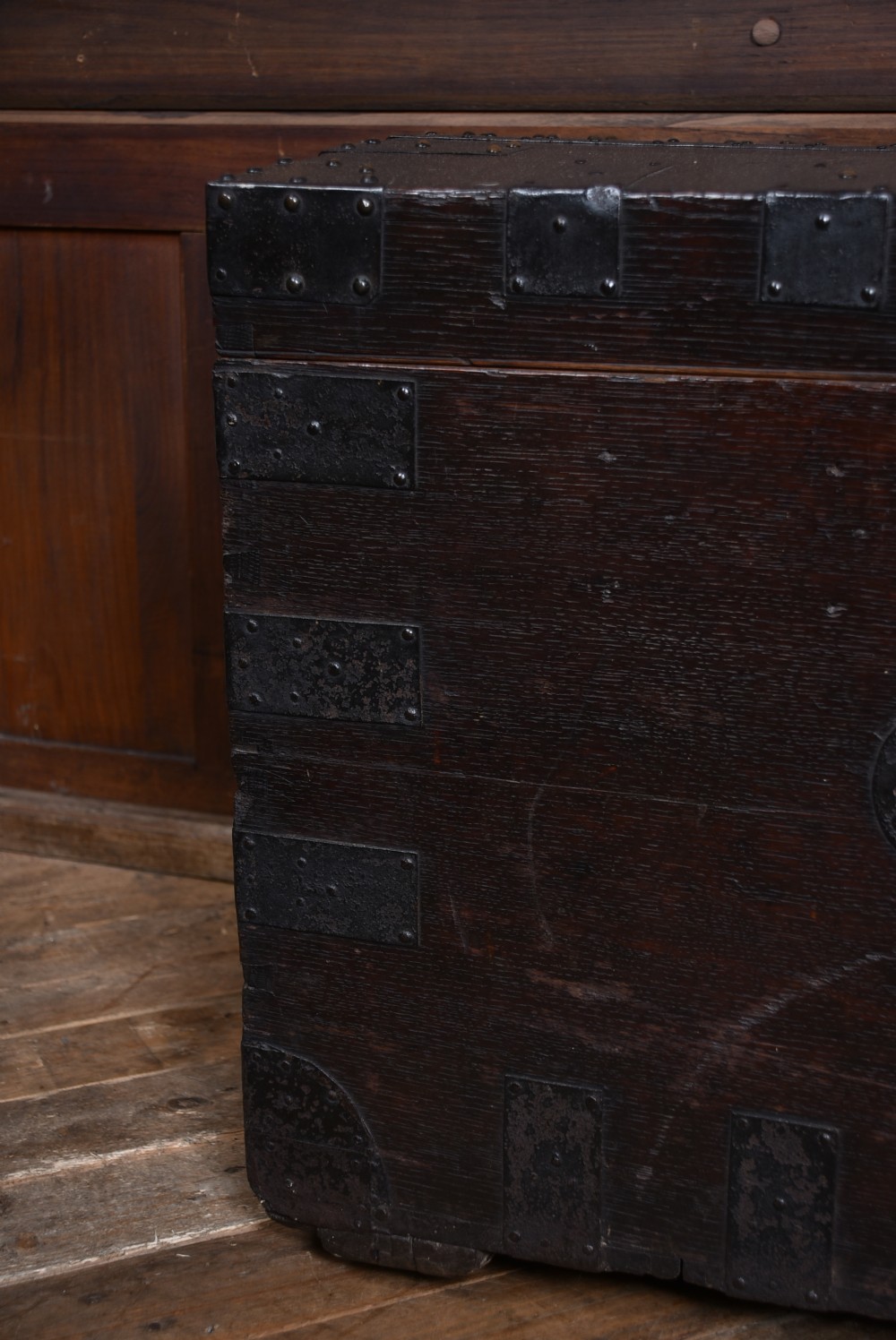 A dark oak Victorian silver chest featuring heavy black iron straps, corner brackets, studded detailing, and an engraved brass plaque on the front. View VIII