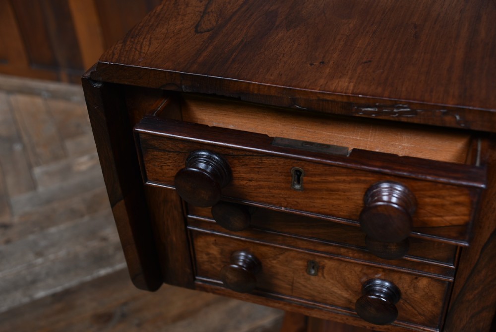 A Victorian rosewood drop-leaf work table featuring three drawers with turned wooden knobs and a central pedestal support on a shaped base. View XIII
