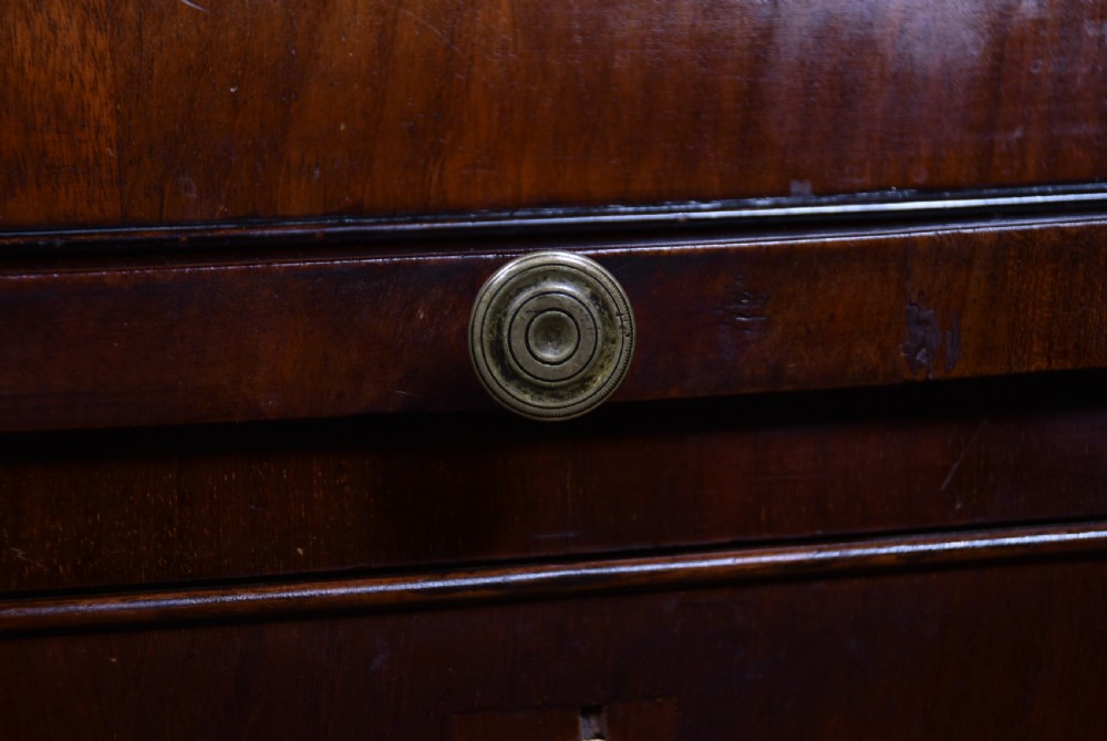 An antique walnut cylinder bureau featuring three full-width drawers with cast brass drop handles and keyhole escutcheons. View VIII
