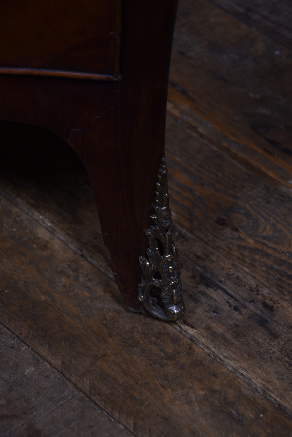 An antique walnut cylinder bureau featuring three full-width drawers with cast brass drop handles and keyhole escutcheons. View X