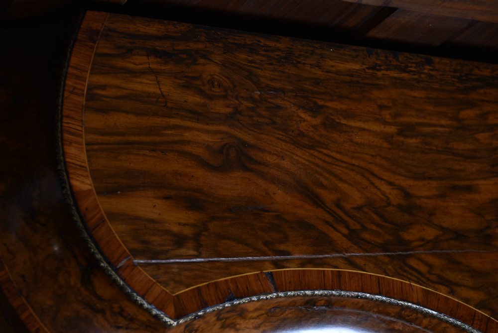 A Victorian burr walnut credenza featuring glazed doors, delicate marquetry inlay, and decorative gilt-metal mounts. View VIII