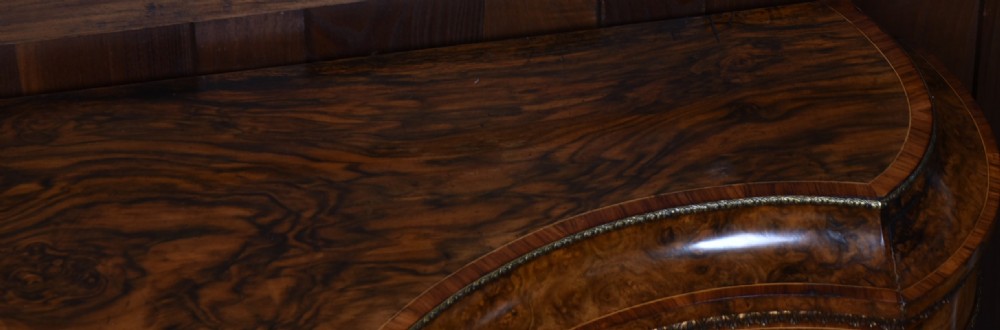 A Victorian burr walnut credenza featuring glazed doors, delicate marquetry inlay, and decorative gilt-metal mounts. View XXII