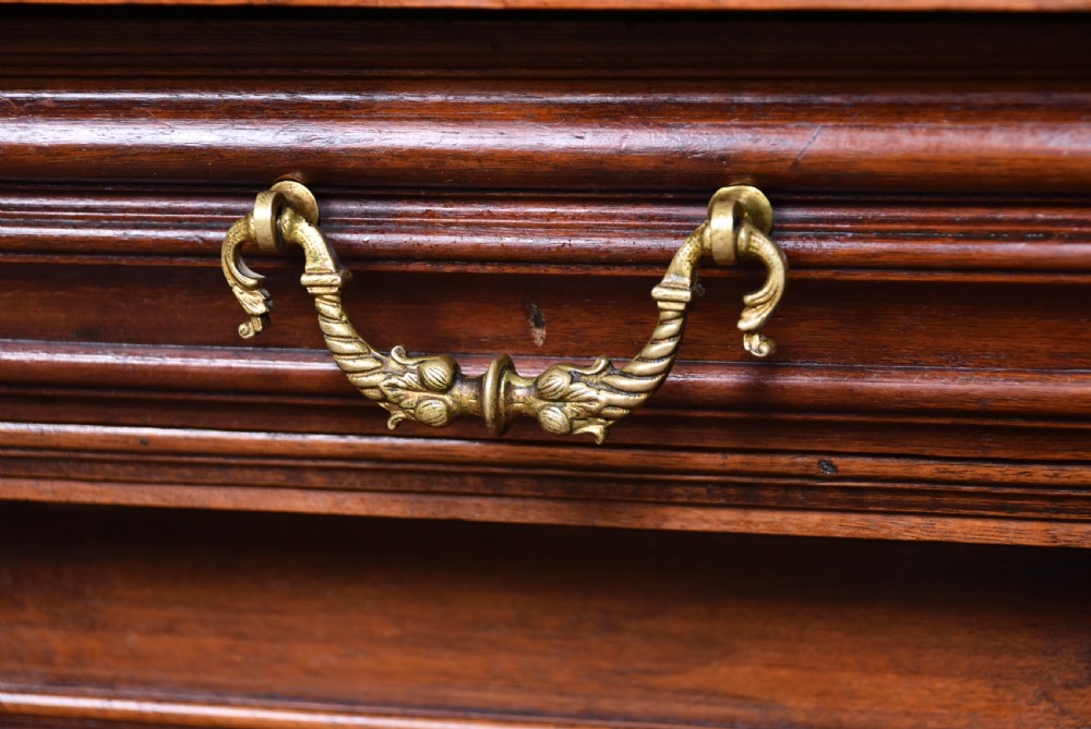 A pair of ornate dark walnut two-tier Continental cabinets featuring intricate carvings, turned columns, geometric panelled doors, and parquetry tops. View XV