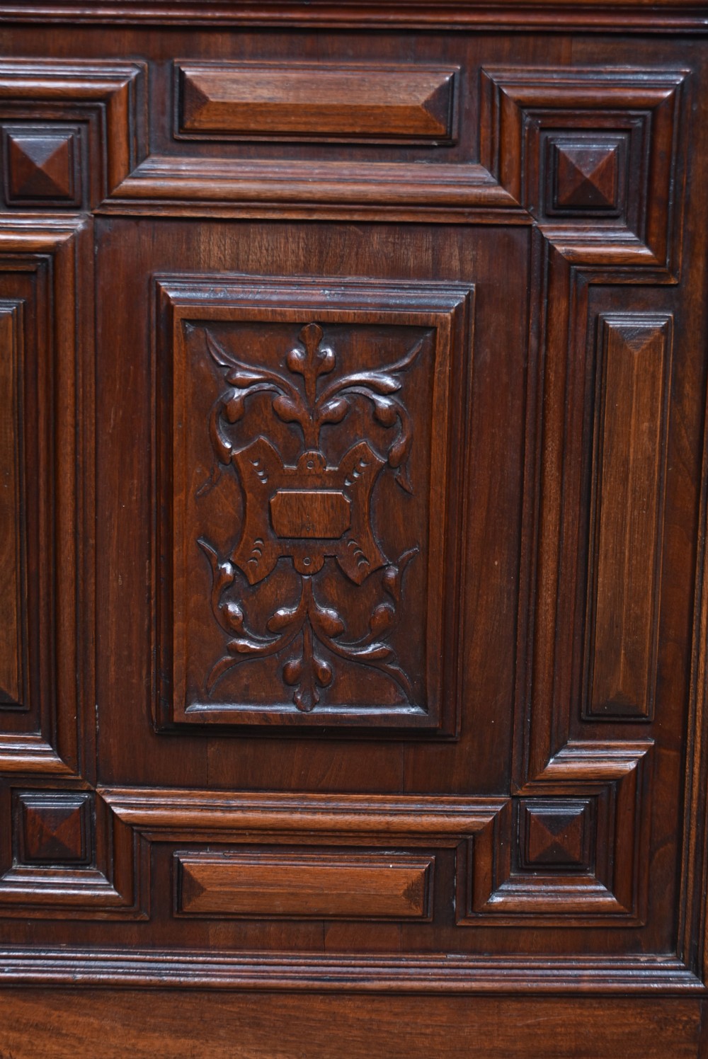 A pair of ornate dark walnut two-tier Continental cabinets featuring intricate carvings, turned columns, geometric panelled doors, and parquetry tops. View XVII