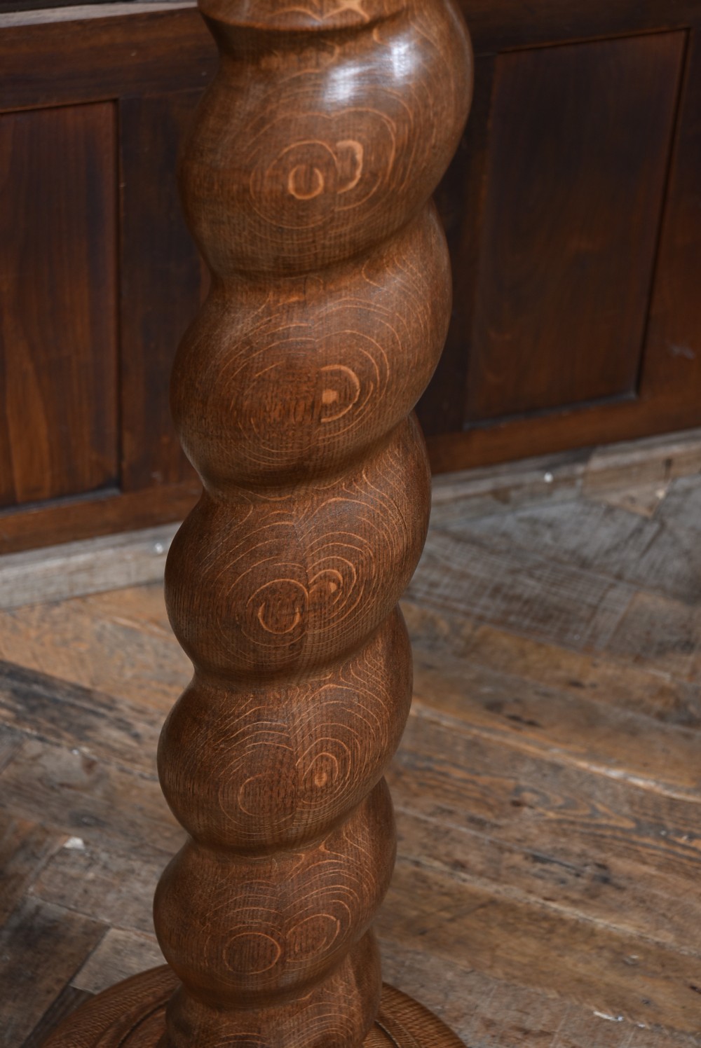 A tall Victorian carved oak pedestal featuring a Corinthian-style capital, a central spiral twist column, and a circular moulded base. View III