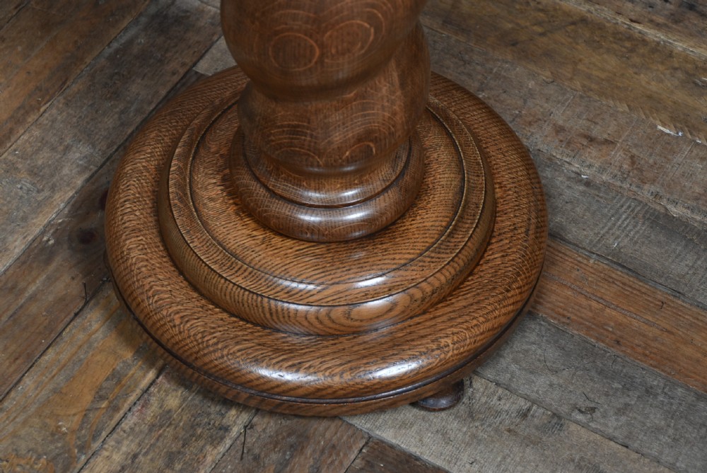 A tall Victorian carved oak pedestal featuring a Corinthian-style capital, a central spiral twist column, and a circular moulded base. View VII