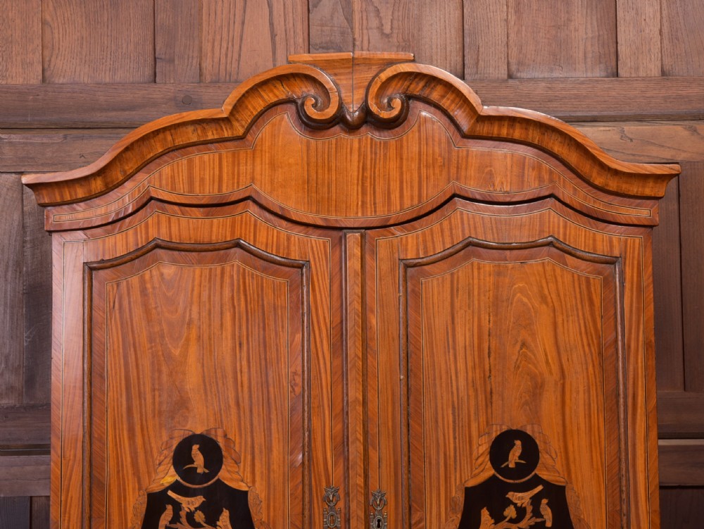 An 18th-century Dutch walnut bombe bureau bookcase featuring inlaid bird motifs, a sloping drop-front desk, shaped drawers, and carved claw feet. View II